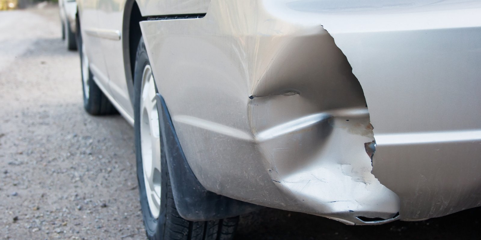 Photo of a silver car with a damaged rear bumper, highlighting the aftermath of a hit-and-run accident in the San Gabriel Valley and the importance of documenting vehicle damage.