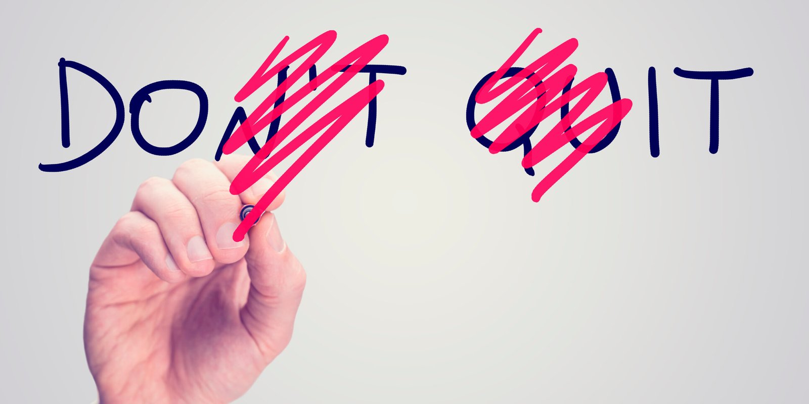 Motivational message “Don’t Quit” with the word “Don’t” crossed out, symbolizing the perseverance of a personal injury attorney fighting for justice.