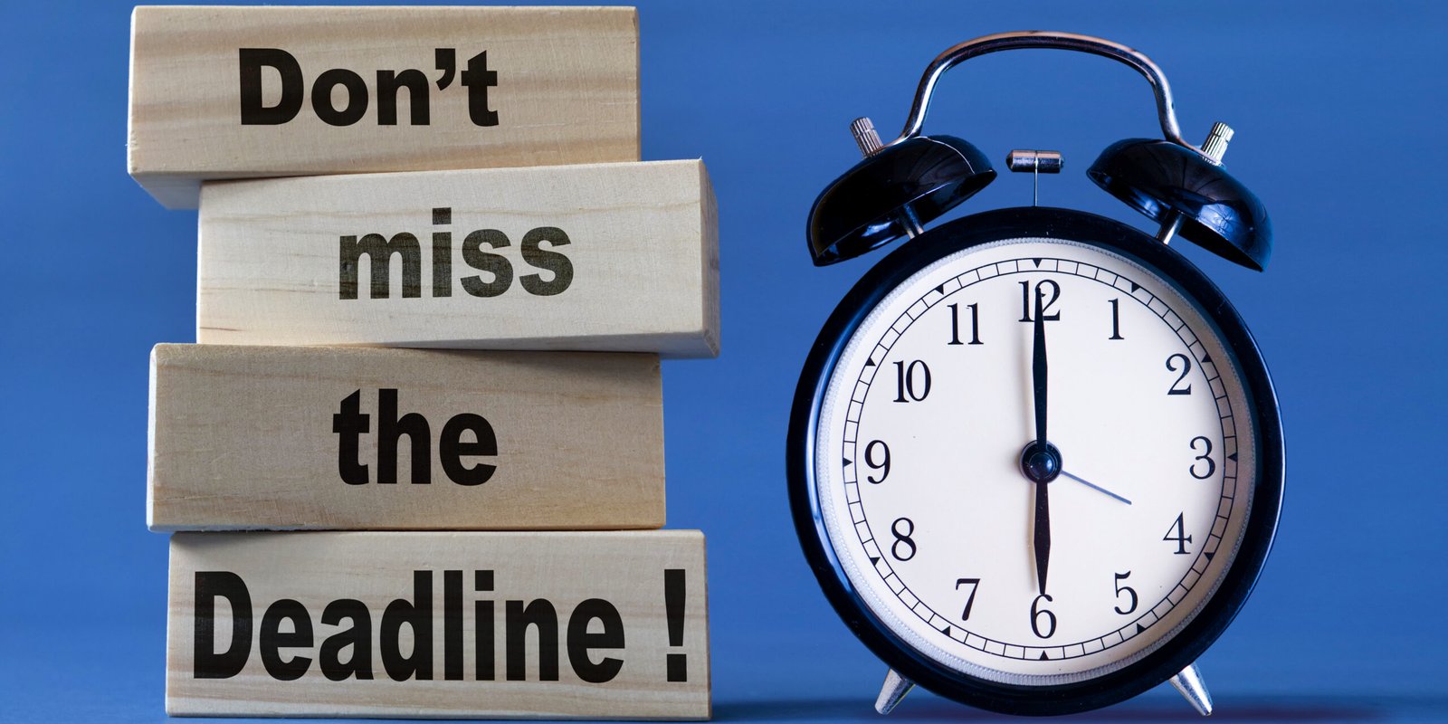 Wooden blocks with the words "Don't miss the Deadline!" next to a classic alarm clock, symbolizing the urgency of understanding the statute of limitations for personal injury attorney claims.